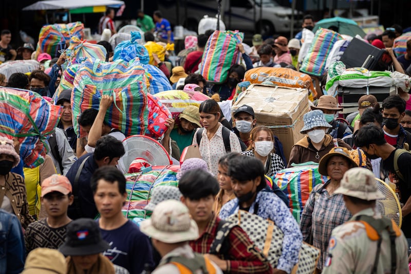 Cambodian migrant workers cross the Ban Laem border checkpoint in large numbers with all of their belongings on July 29, 2025 in Chanthaburi, Thailand.