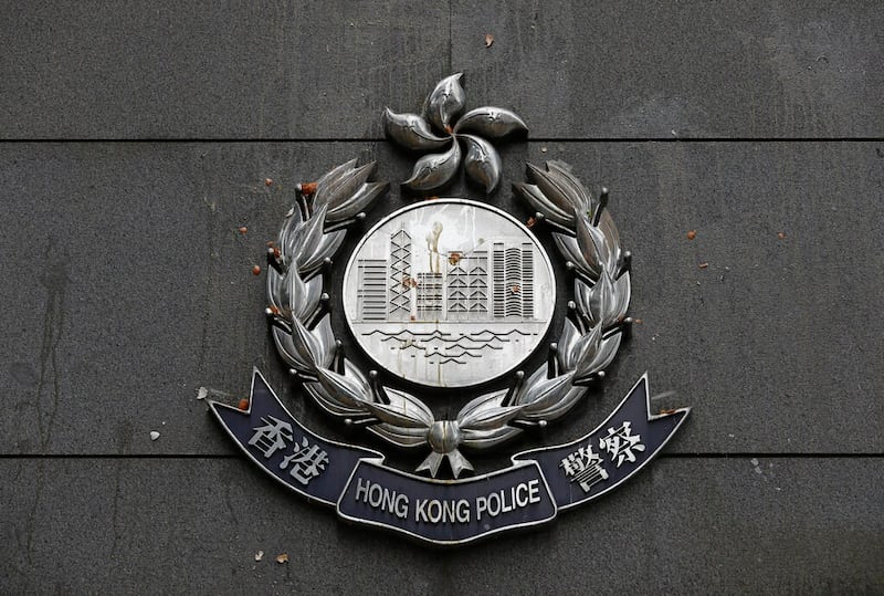 Eggs thrown by protestors are splattered on a police badge at the police headquarters in Hong Kong, June 22, 2019. Credit: Associated Press