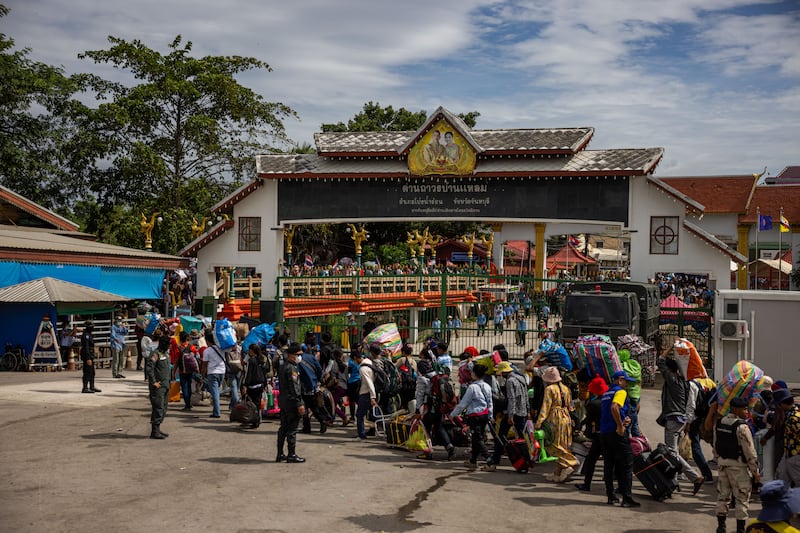 Cambodian migrant workers cross the Ban Laem border checkpoint in large numbers with all of their belongings on July 29, 2025 in Chanthaburi, Thailand.