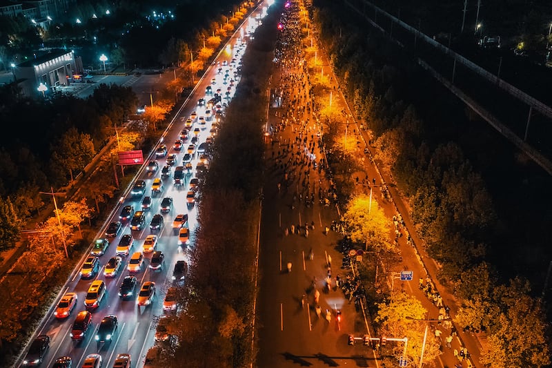 Thousands of college students ride bicycles on the Zhengkai Road in Zhengzhou, in China's Henan province, Nov.  9, 2024.