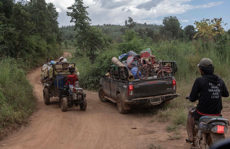 People flee from Phuk Khe village as Myanmar junta attacks Moe Bye to Peinnegon main road in South Shan state, Myanmar, Oct. 30, 2024.